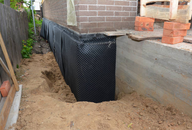 Happy homeowners after waterproofing job in Haskell
